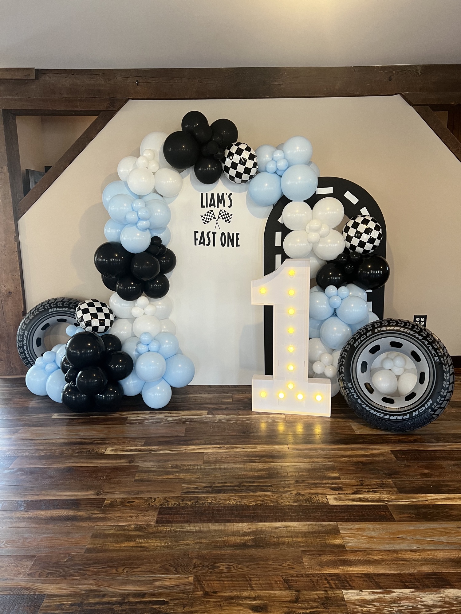 Race car themed first birthday balloon installation.